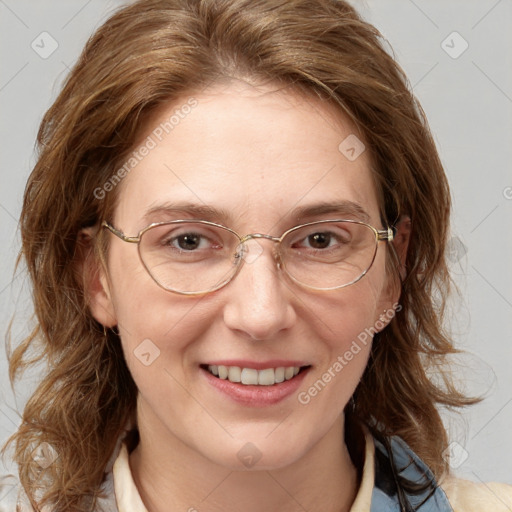 Joyful white adult female with medium  brown hair and blue eyes