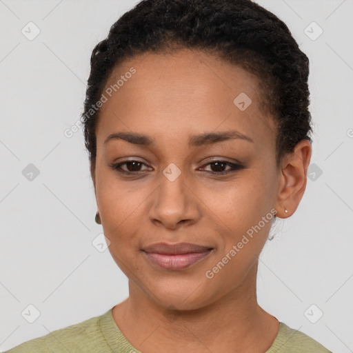 Joyful black young-adult female with short  black hair and brown eyes