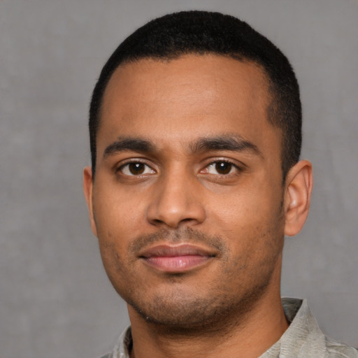 Neutral latino young-adult male with short  black hair and brown eyes