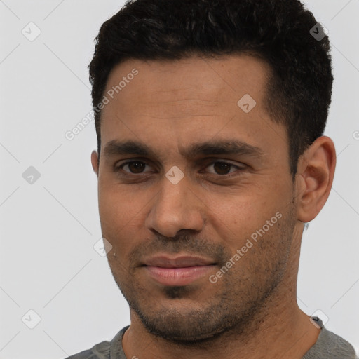Joyful white young-adult male with short  black hair and brown eyes
