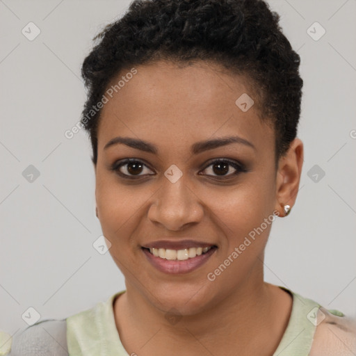 Joyful black young-adult female with short  brown hair and brown eyes