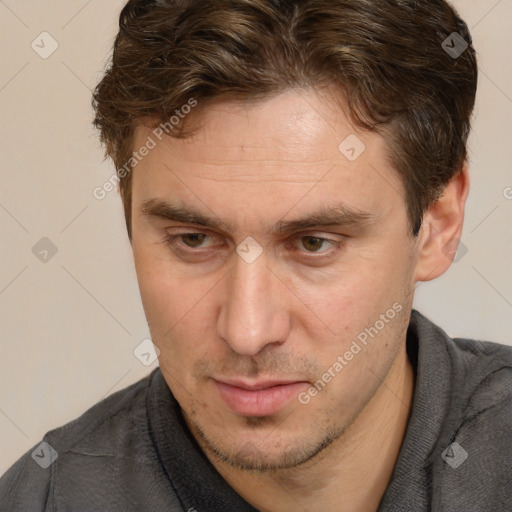 Joyful white adult male with short  brown hair and brown eyes