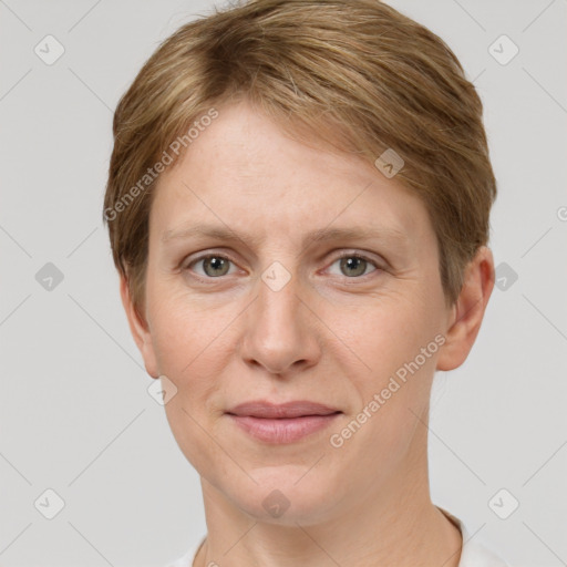 Joyful white adult female with short  brown hair and grey eyes