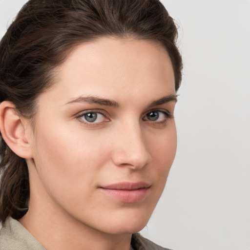 Neutral white young-adult female with medium  brown hair and grey eyes