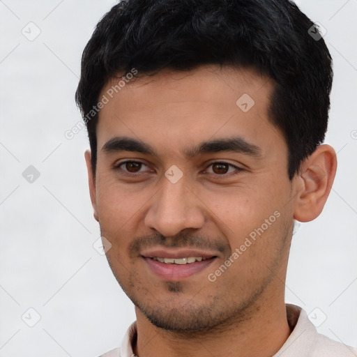 Joyful latino young-adult male with short  black hair and brown eyes