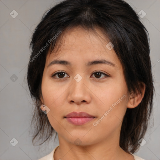 Joyful asian young-adult female with medium  brown hair and brown eyes