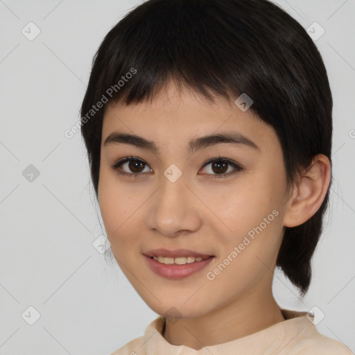 Joyful asian young-adult female with medium  black hair and brown eyes