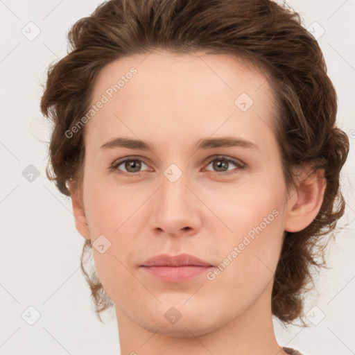 Joyful white young-adult female with medium  brown hair and green eyes