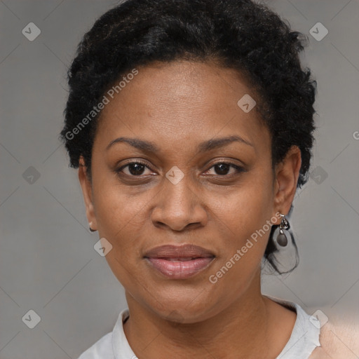 Joyful black adult female with short  black hair and brown eyes