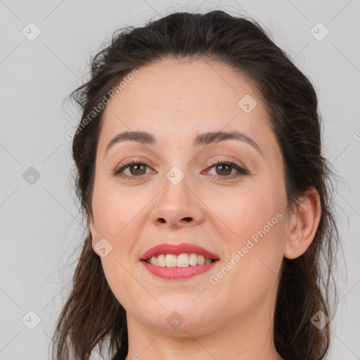 Joyful white young-adult female with long  brown hair and brown eyes