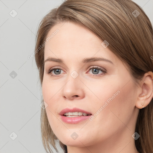 Joyful white young-adult female with long  brown hair and grey eyes