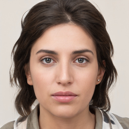 Neutral white young-adult female with medium  brown hair and brown eyes