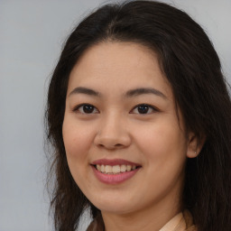 Joyful asian young-adult female with long  brown hair and brown eyes