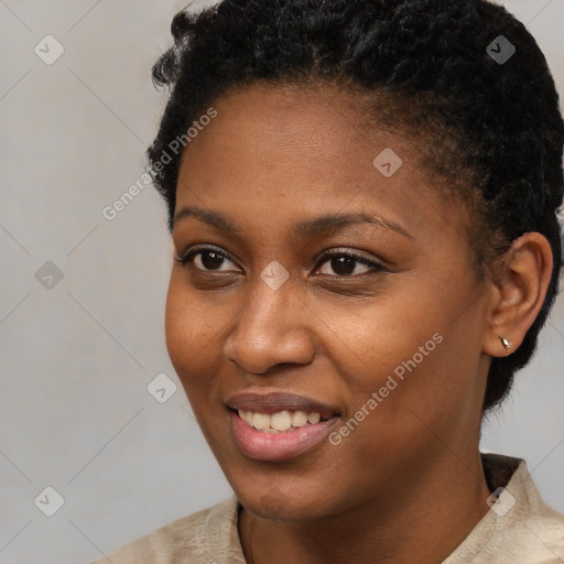 Joyful black young-adult female with short  black hair and brown eyes