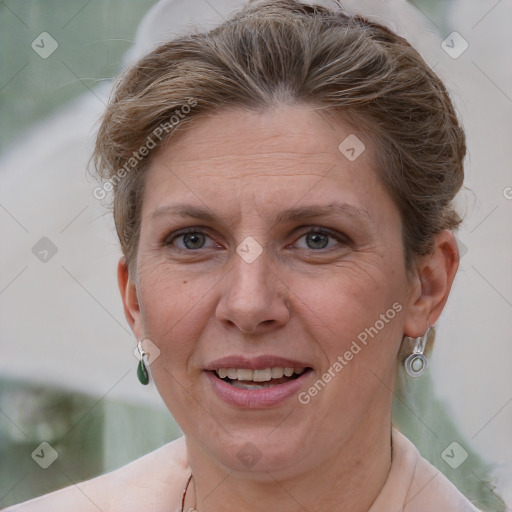 Joyful white adult female with short  brown hair and grey eyes