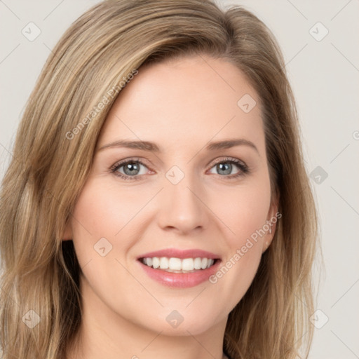 Joyful white young-adult female with long  brown hair and green eyes