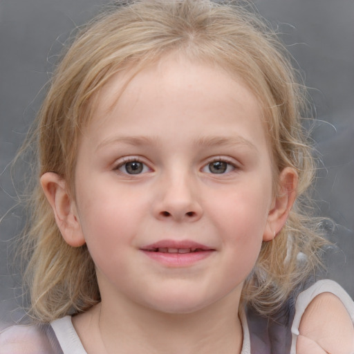 Joyful white child female with medium  brown hair and grey eyes