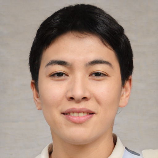 Joyful asian young-adult male with short  black hair and brown eyes