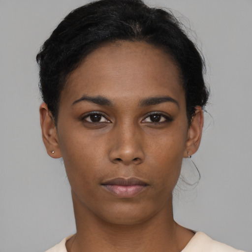 Neutral black young-adult female with short  brown hair and brown eyes