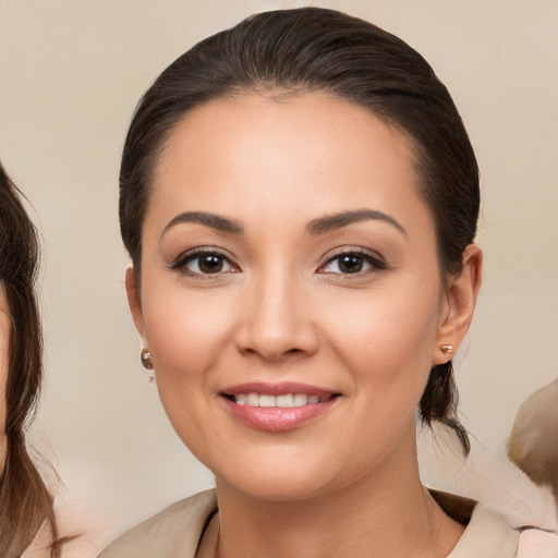 Joyful white young-adult female with medium  brown hair and brown eyes