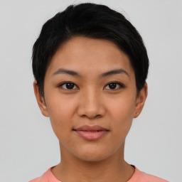 Joyful asian young-adult female with short  black hair and brown eyes