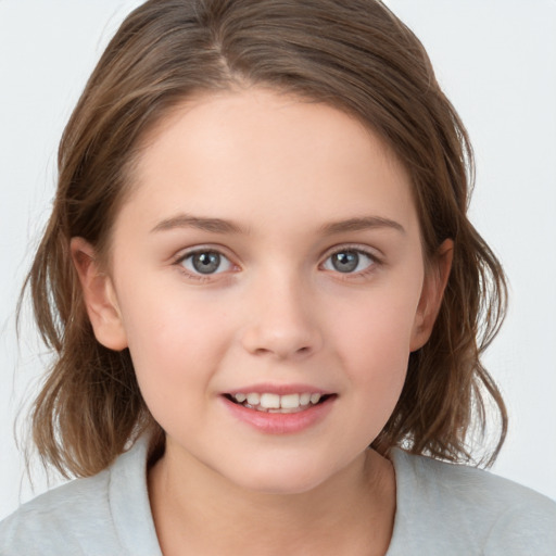 Joyful white child female with medium  brown hair and brown eyes