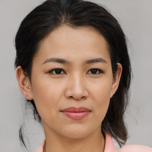 Joyful asian young-adult female with medium  brown hair and brown eyes