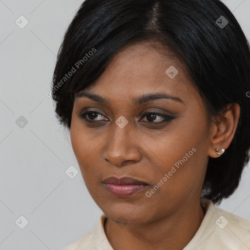 Joyful asian young-adult female with medium  black hair and brown eyes