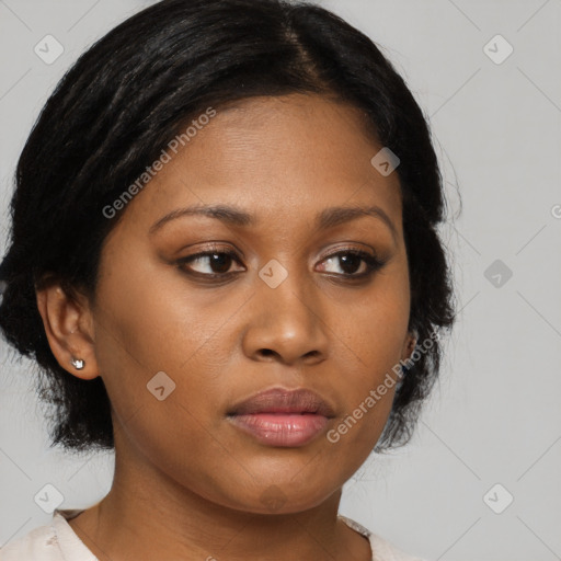 Joyful black young-adult female with medium  brown hair and brown eyes