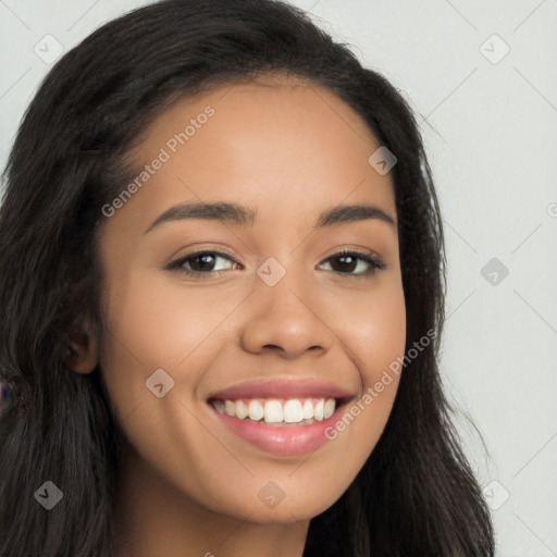 Joyful latino young-adult female with long  brown hair and brown eyes