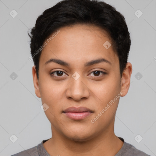 Joyful latino young-adult female with short  black hair and brown eyes