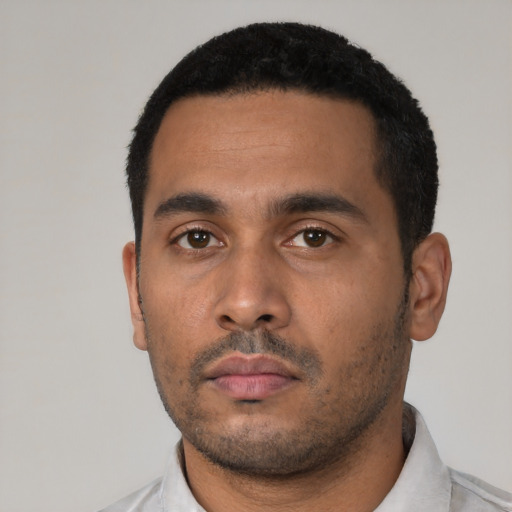 Neutral latino young-adult male with short  black hair and brown eyes