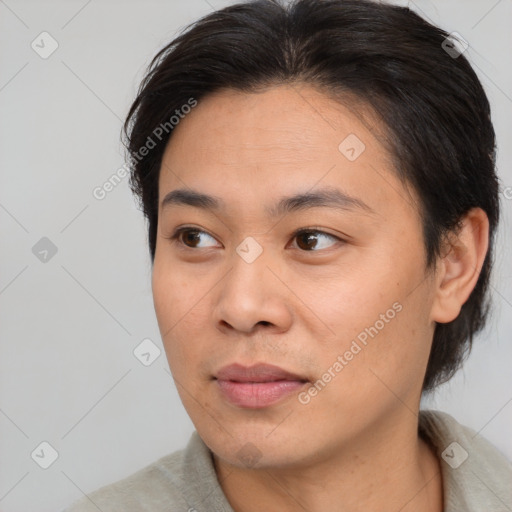 Joyful asian young-adult female with short  brown hair and brown eyes