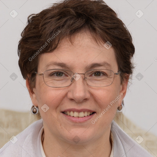 Joyful white adult female with short  brown hair and grey eyes