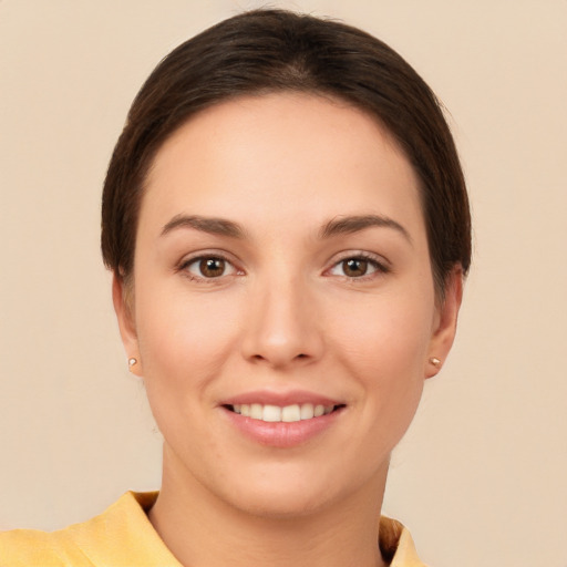 Joyful white young-adult female with short  brown hair and brown eyes