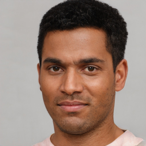 Neutral black young-adult male with short  black hair and brown eyes