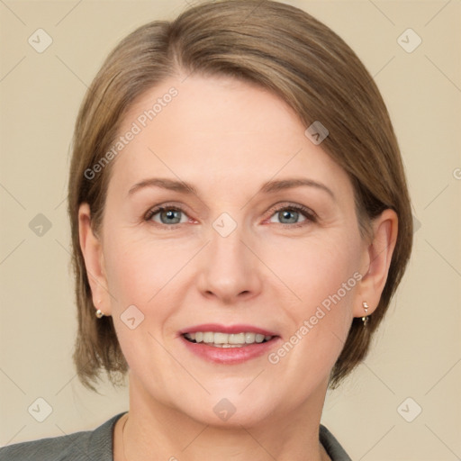 Joyful white adult female with medium  brown hair and grey eyes