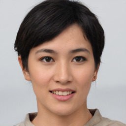 Joyful asian young-adult female with short  brown hair and brown eyes