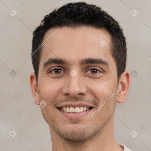 Joyful white young-adult male with short  black hair and brown eyes