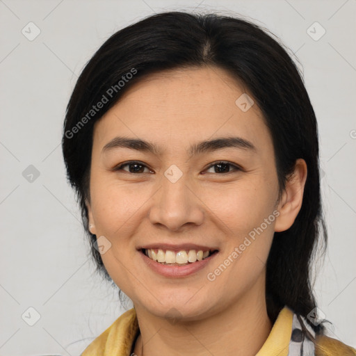 Joyful latino young-adult female with medium  brown hair and brown eyes