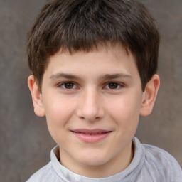 Joyful white child male with short  brown hair and brown eyes