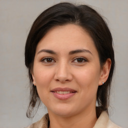 Joyful white young-adult female with medium  brown hair and brown eyes