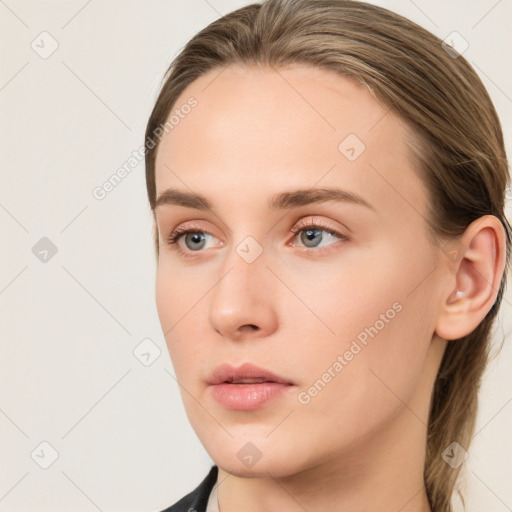 Neutral white young-adult female with long  brown hair and blue eyes