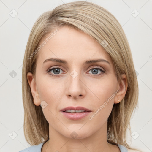 Joyful white young-adult female with medium  brown hair and blue eyes