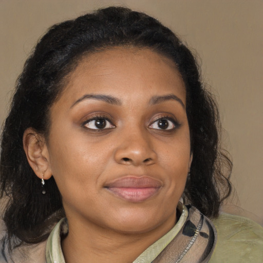 Joyful black young-adult female with medium  brown hair and brown eyes