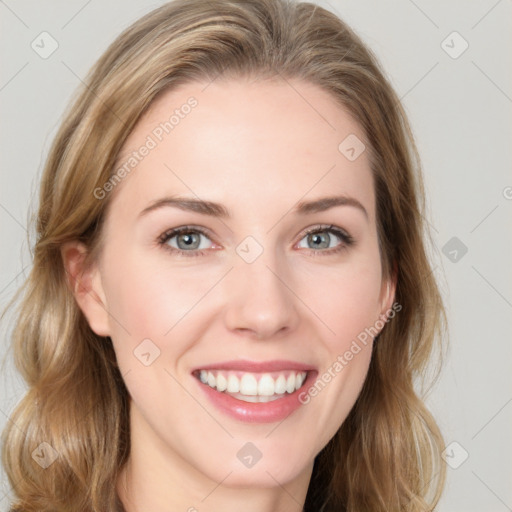 Joyful white young-adult female with long  brown hair and blue eyes