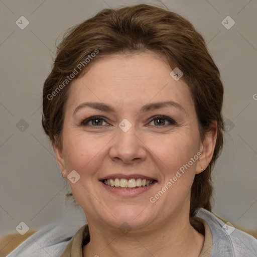 Joyful white adult female with short  brown hair and brown eyes