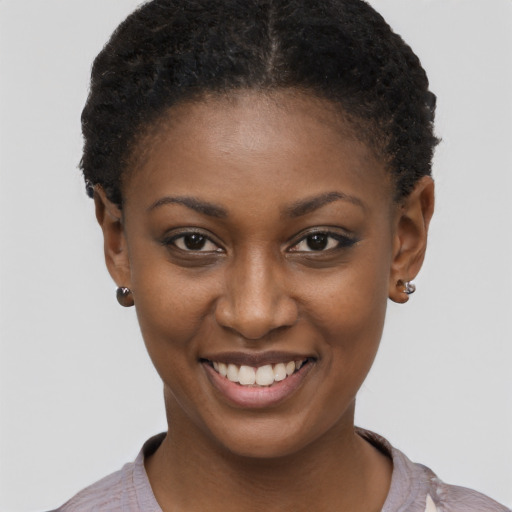 Joyful black young-adult female with short  brown hair and brown eyes