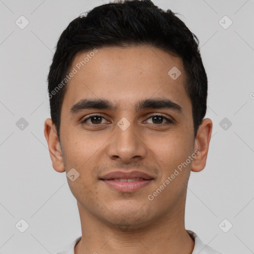 Joyful latino young-adult male with short  brown hair and brown eyes