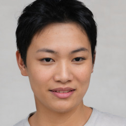 Joyful asian young-adult female with short  black hair and brown eyes